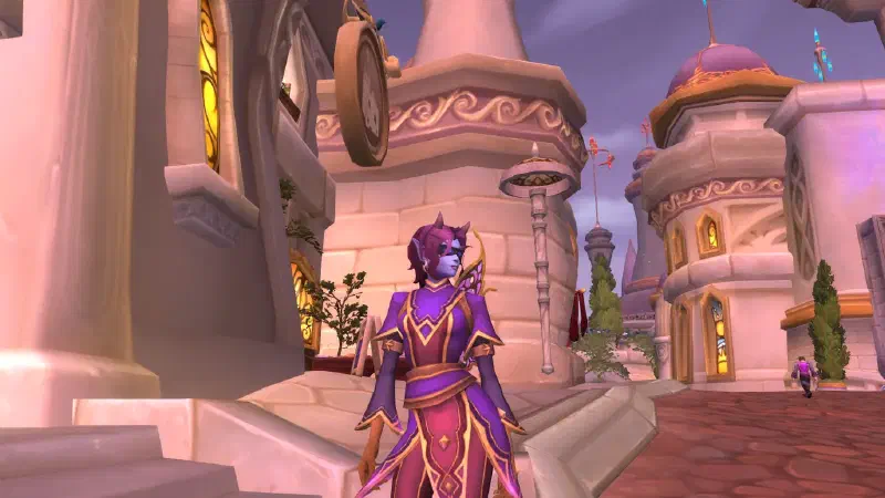Ecliseese standing on a Dalaran street in her violet robe and gold filigree wings