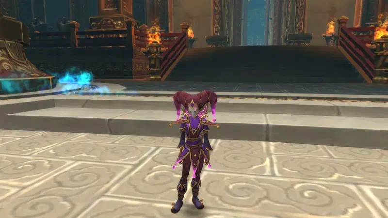 Ecliseese in her full jester ensemble, facing forward on a temple floor